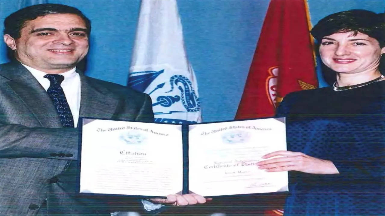 An undated handout image from a U.S. Department of Defense report dating back to 2005 shows Ana Belen Montes receiving a national intelligence certificate of distinction from George Tenet, who served as Director of Central Intelligence (DCI) for the United States Central Intelligence Agency. U.S. Department of Defense