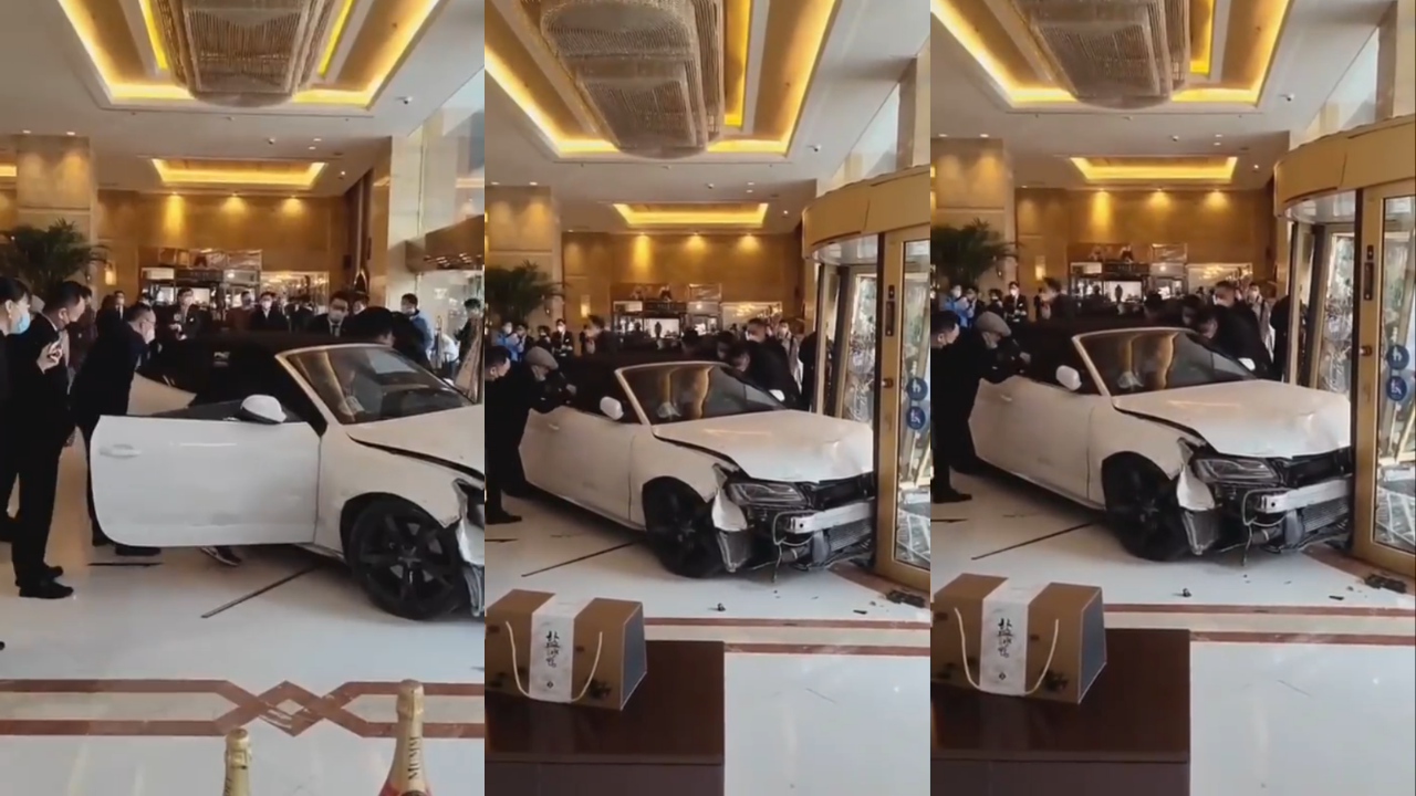 Audi smashing through hotel glass door