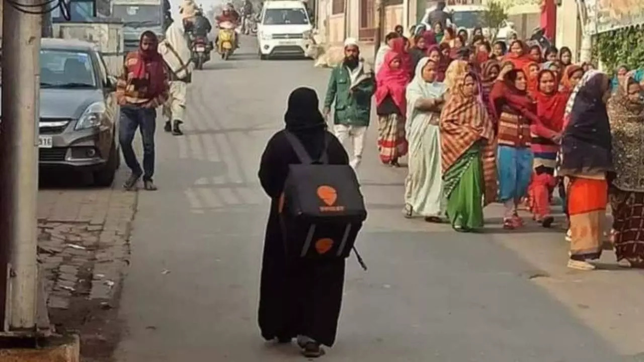 Rizwana went viral as the 'Burqa-clad woman with a Swiggy bag' after being photographed while walking down a street in Lucknow | Picture: Twitter