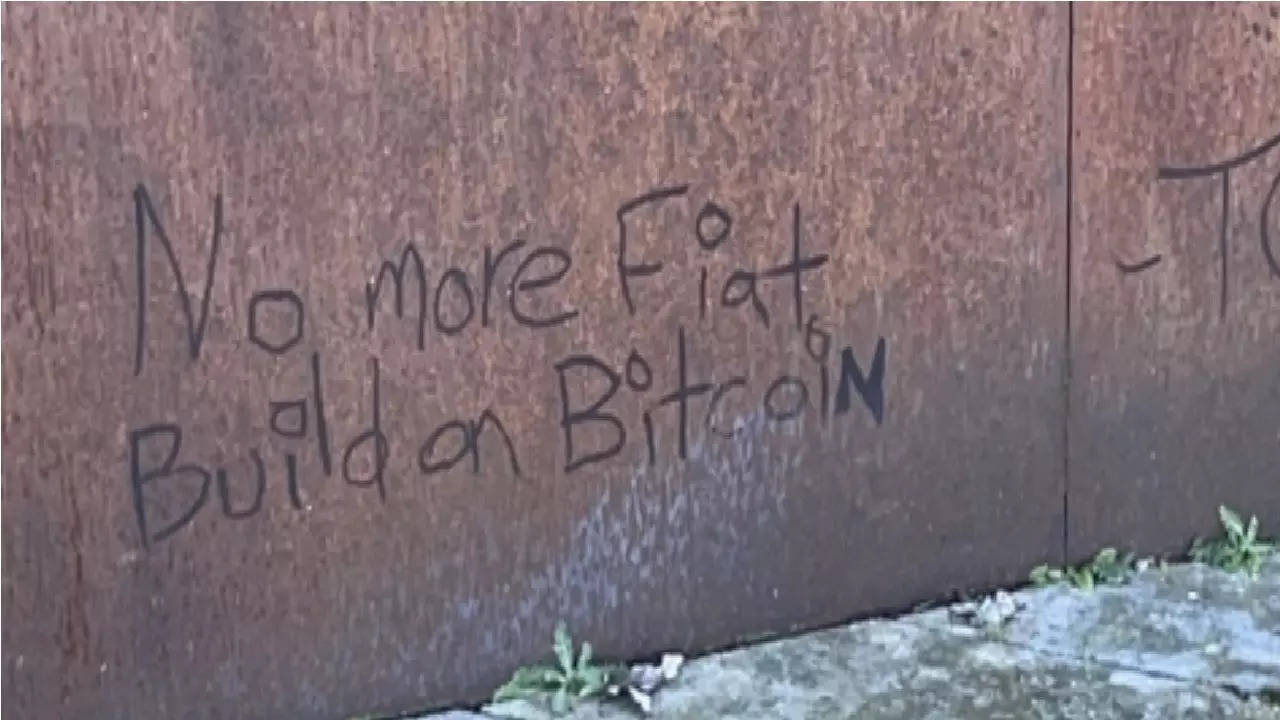 The message defacing the memorial said: 'No more Fiat build on Bitcoin.'