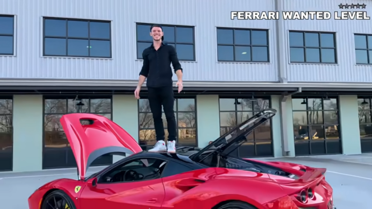 Youtuber Detwiler from WhistlinDiesel channel on top of his Ferrari F8  (screenshot from the video)