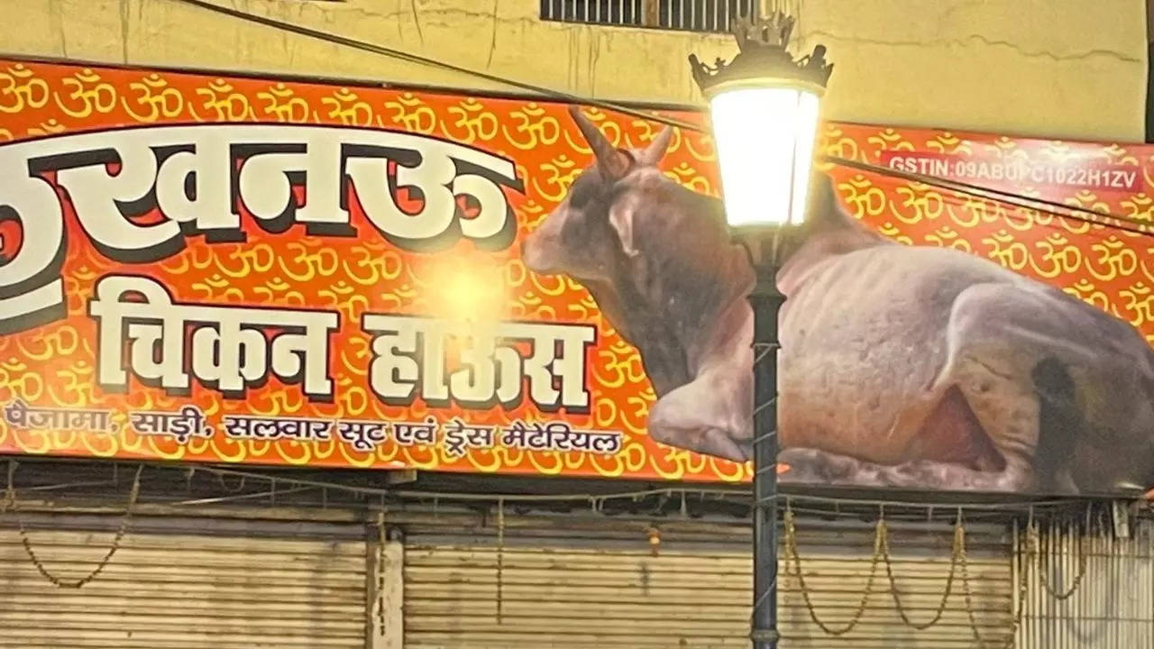 Pedestrians in Varanasi can't help looking twice at the curious signboard of a clothes shop named Lucknow Chikan House |@manicmande/Twitter