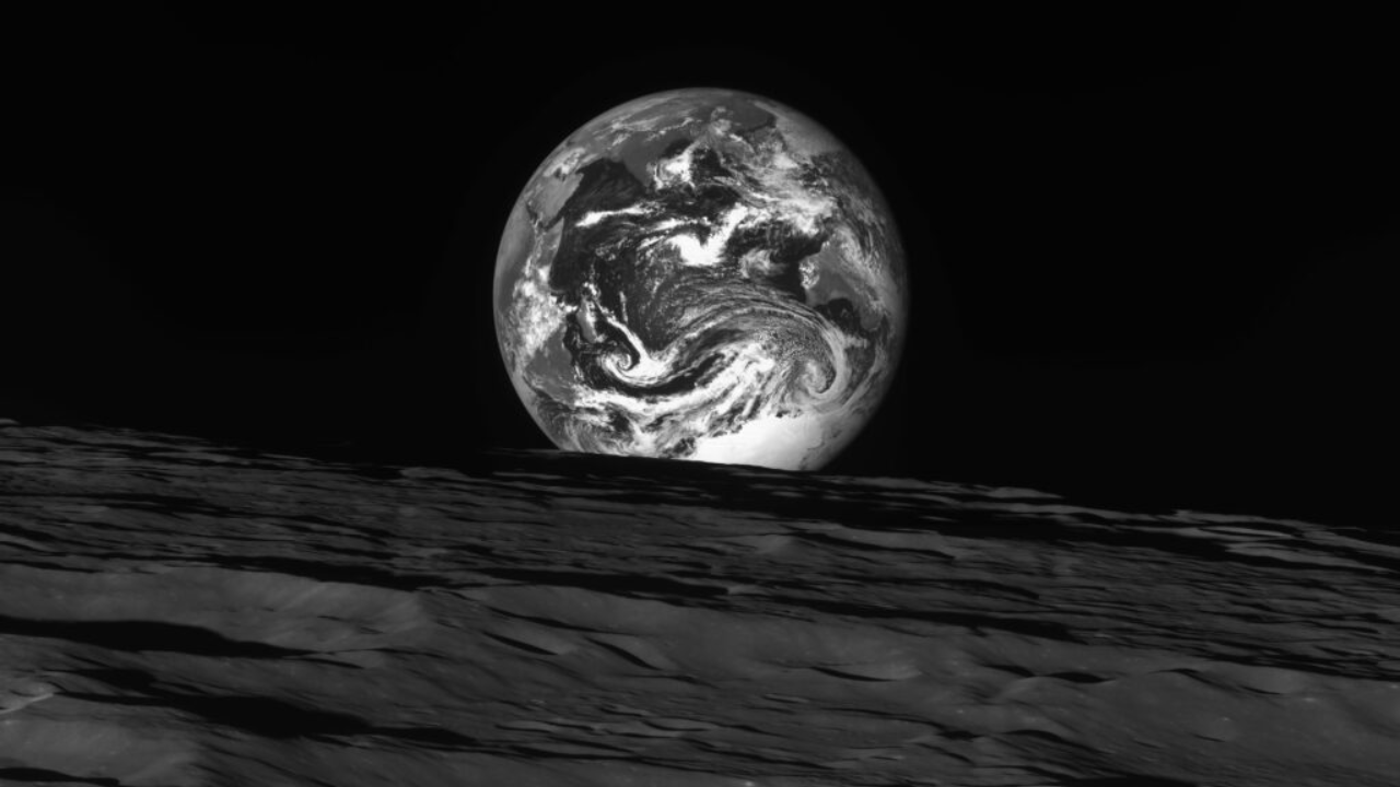 Earth rising above the Moon