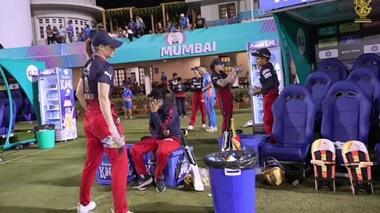 Ellyse Perry cleans dugout.