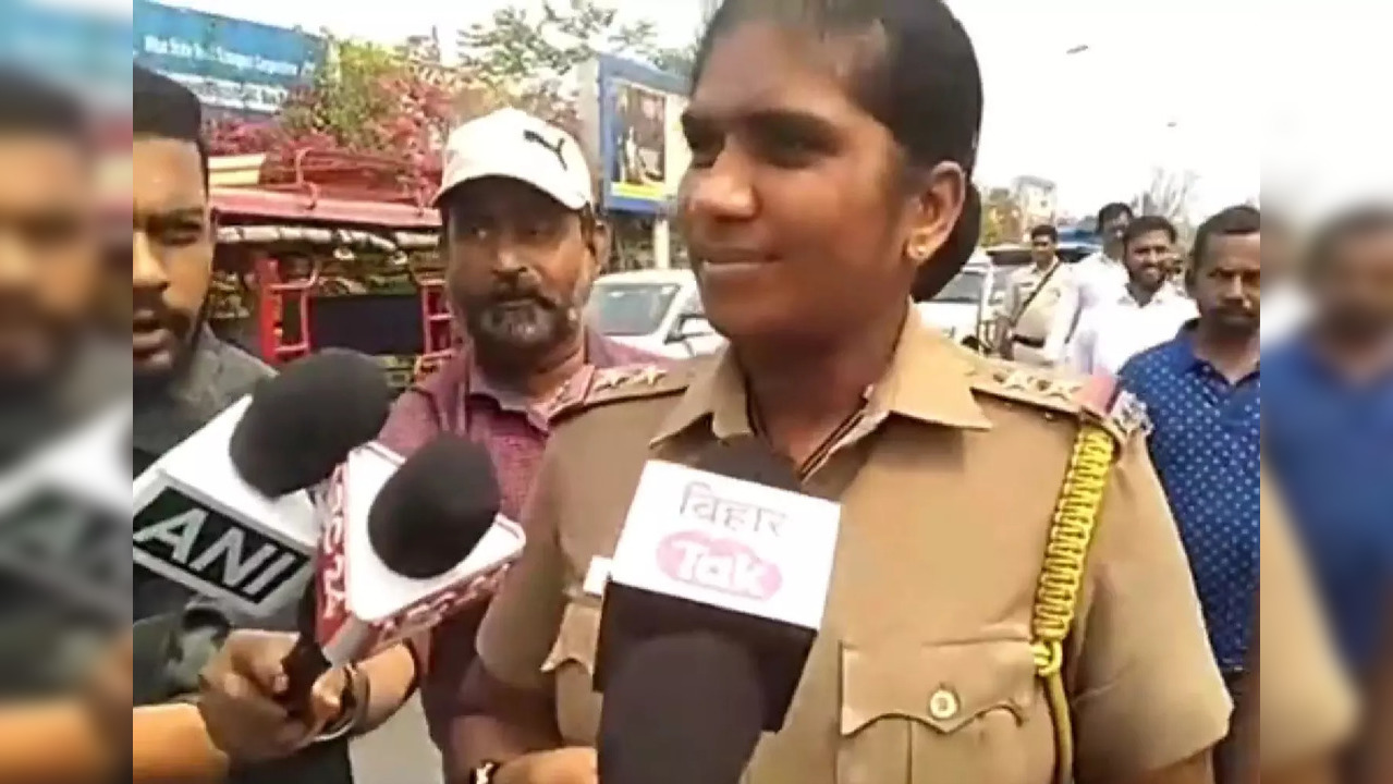 Female officer answers reporters' questions