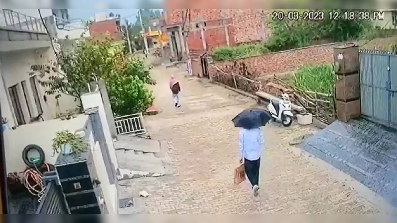 Amritpal Singh leaving house in Haryana carrying umbrella