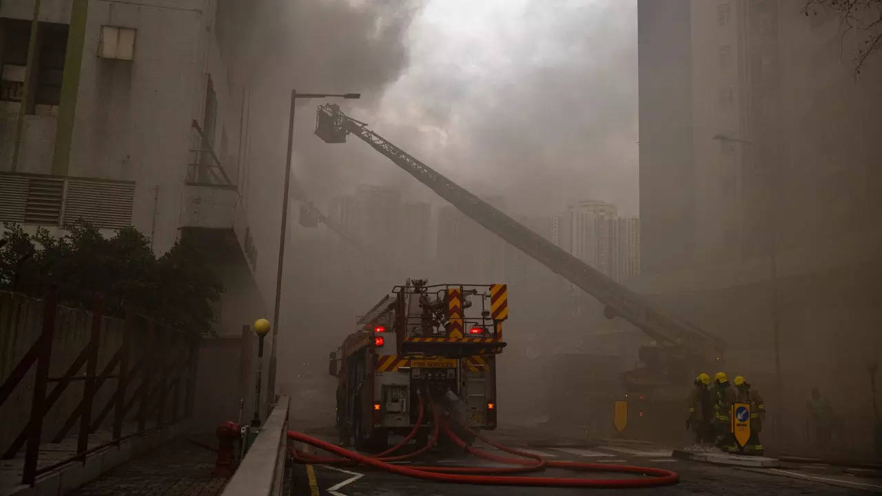 Hong Kong: Firefighters battle the fire on Friday.- AP (4)