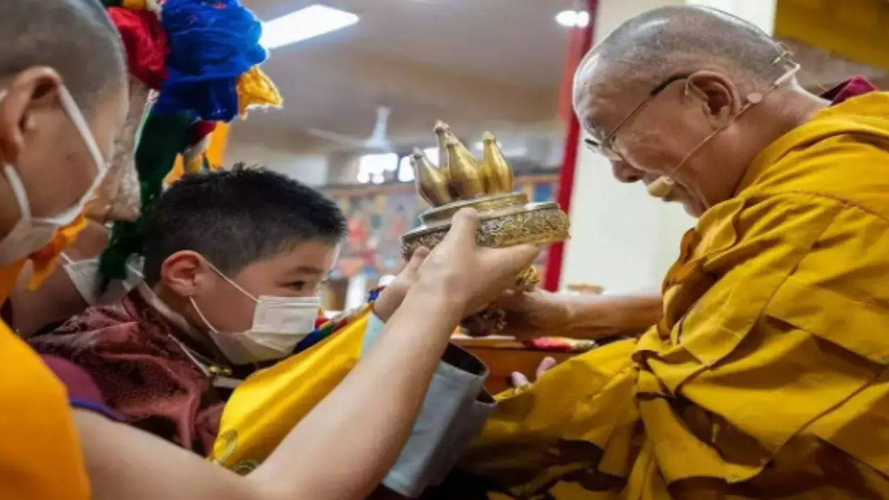 The Dalai Lama was pictured with the boy during a ceremony recognising him as the 10th Khalkha Jetsun Dhampa Rinpoche