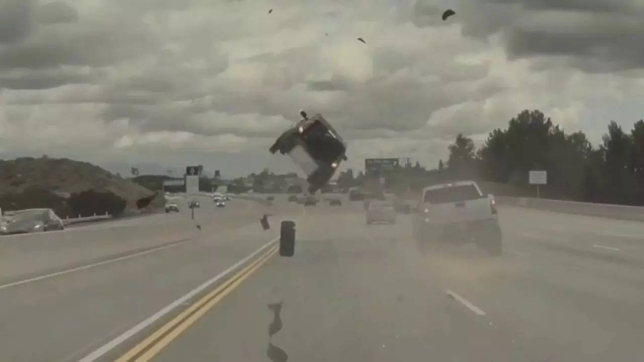 A pickup truck's tyre popped loose and struck a car, sending it flying and flipping in the air during a wild highway accident in California's Los Angeles | Anoop Khatra via Storyful