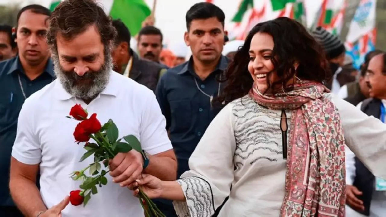 Rahul Gandhi accepting roses from Bollywood actor Swara Bhaskar during Bharat Jodo Yatra.