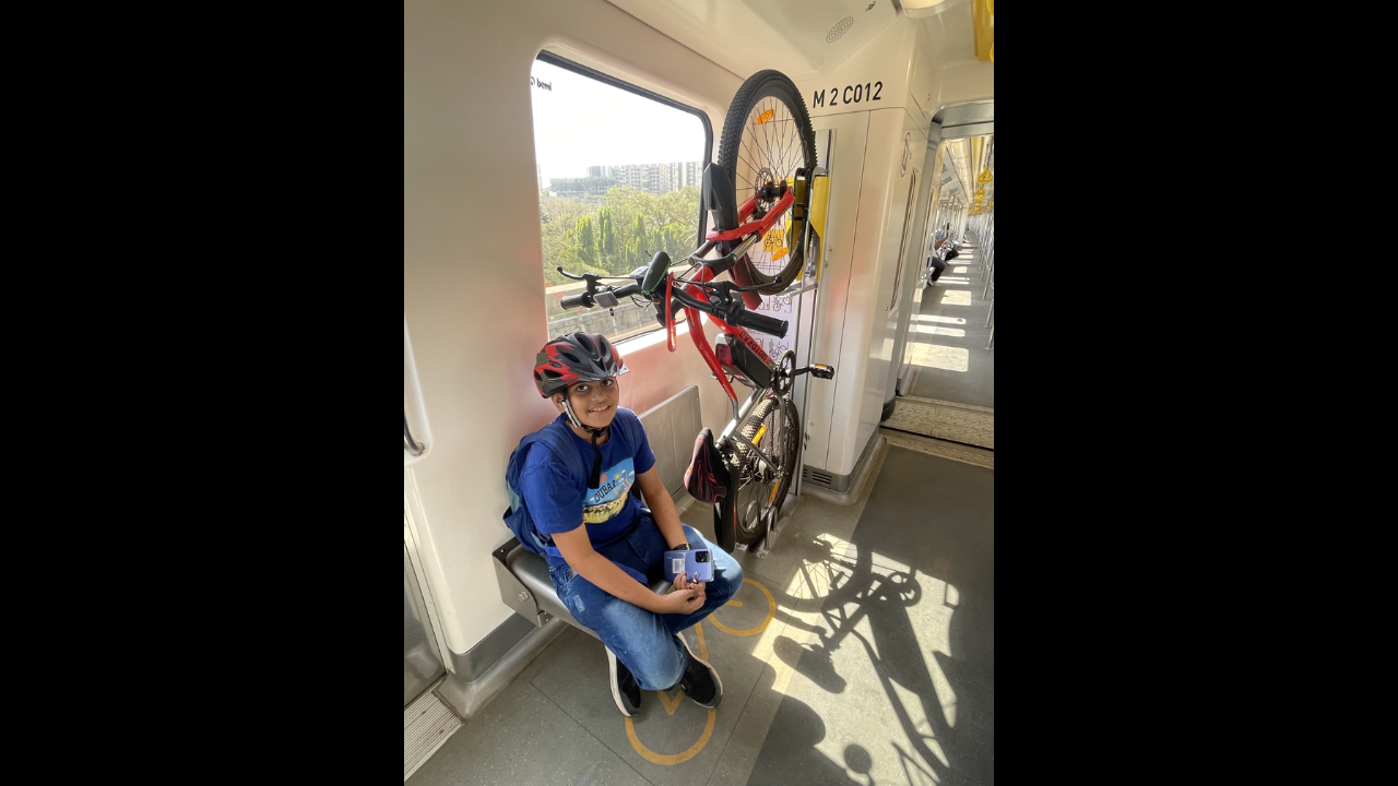 Boy travels with his bicycle on Mumbai Metro daily