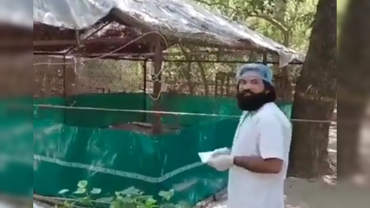 Mohammed Arif stands outside the Sarus Crane enclosure