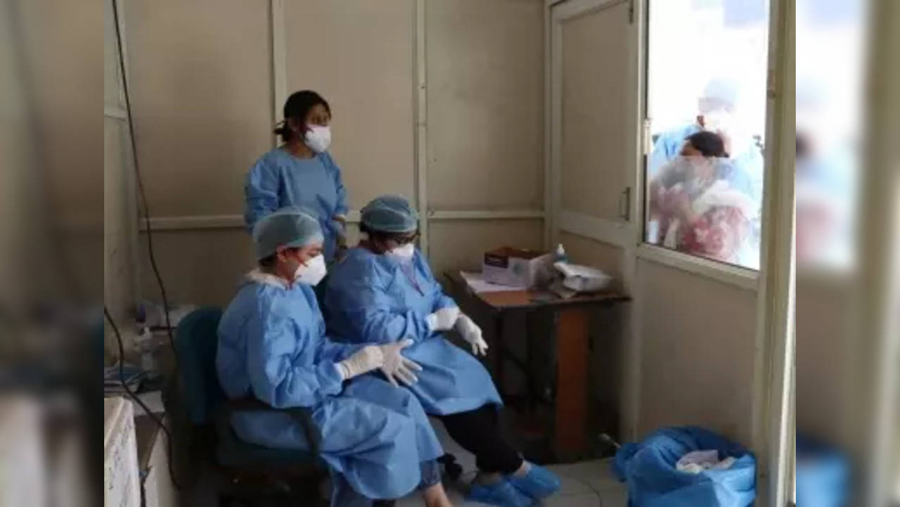 New Delhi: Health workers in a ppe kit while collecting swab samples for the COVID-19 testing amid a spike in Coronavirus cases, at RML Hospital in New Delhi on Monday, April 10, 2023. (Photo: Anupam Gautam/IANS)