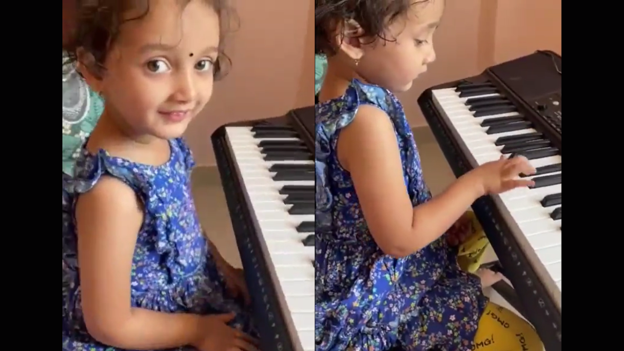 Little girl plays piano