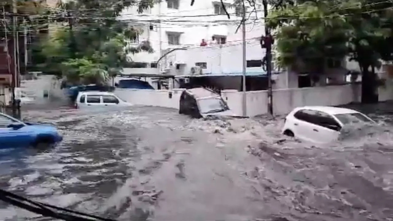 Cars were washed by rainwater during a heavy downpour in Padma Colony, of east Hyderabad's Nallakunta | Screenshot: @iamKavithaRao/Twitter